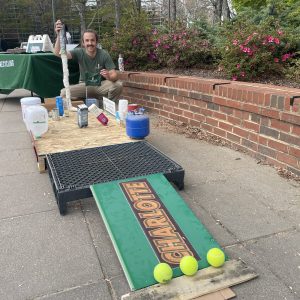 Nich with a handmade putt-putt course created from recycled materials